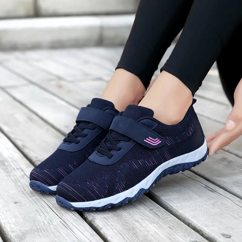 Women's low-top casual shoes with wedge heel, mesh upper, and Velcro closure in solid colours