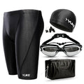 Men's black five-piece swimming set showing trunks, goggles, cap, ear plug nose clip and swimming bag