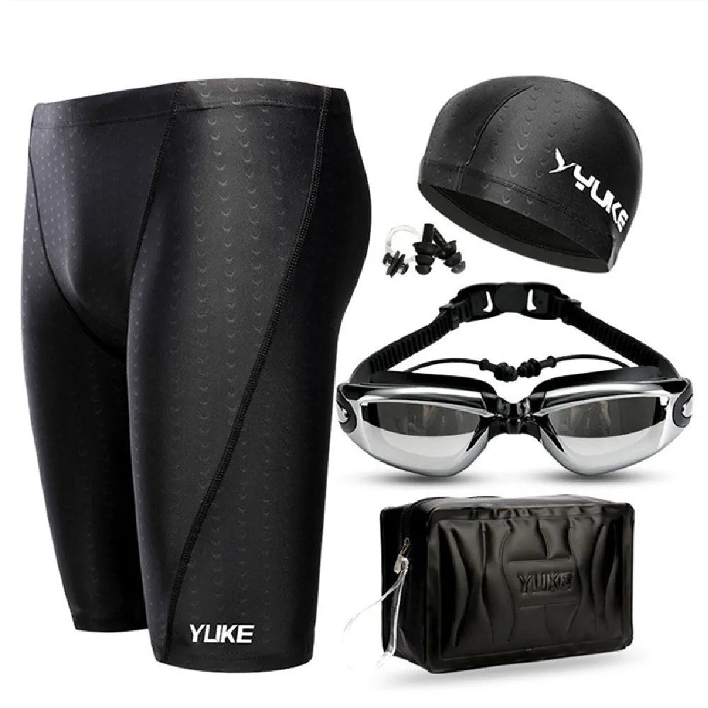 Men's black five-piece swimming set showing trunks, goggles, cap, ear plug nose clip and swimming bag