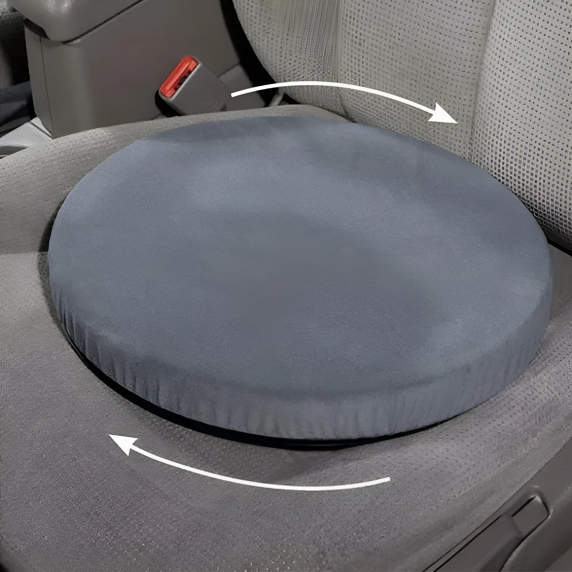 A grey rotating car seat cushion with a non-slip base, shown on a car seat.