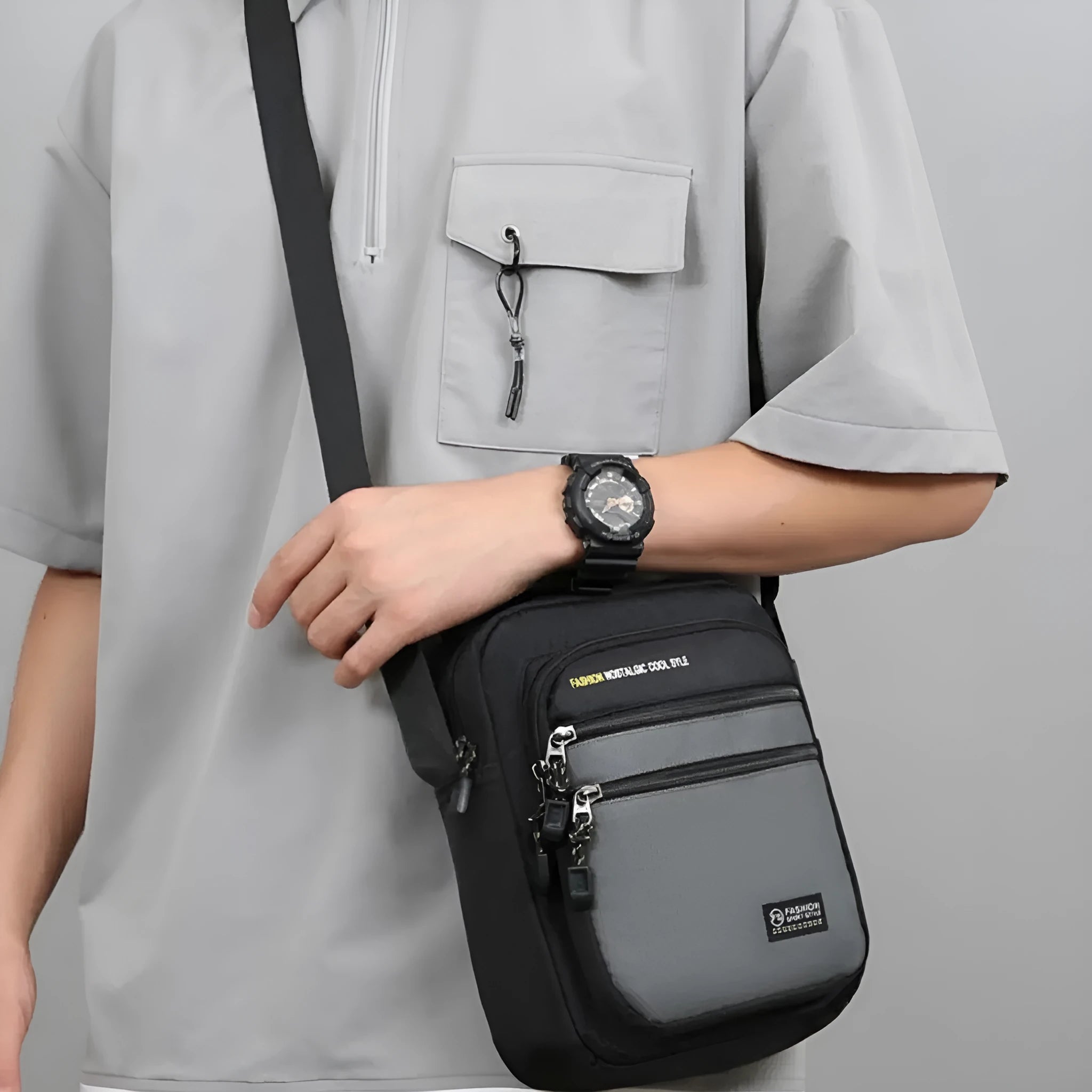 Men's nylon crossbody bag in solid colour with sewing thread detail, shown in green.