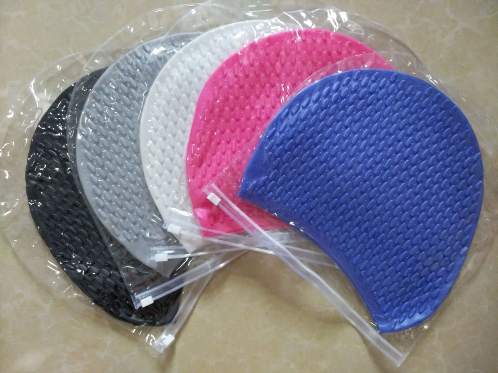 Silicone swimming ear plugs for adults in solid black, blue, gray, pink, white, and yellow