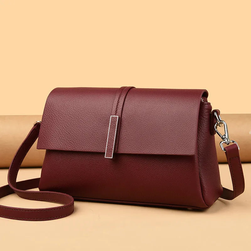 Women's cowhide tote bag in first layer leather, 24x15x9cm, with double shoulder straps, shown in black, gray, or wine red.