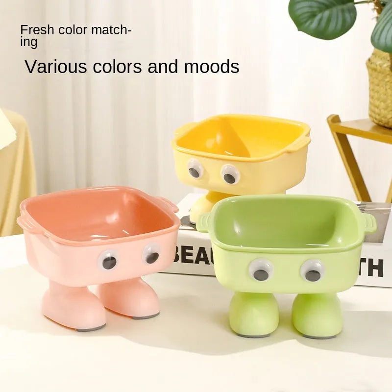 Green robot-shaped elevated cat bowl with 15-degree tilt and detachable inner dish