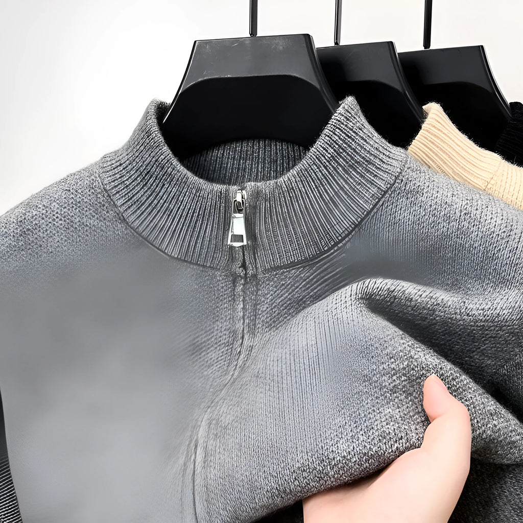 Men's black stand collar zipper cardigan in a loose, thickened knit on a hanger.