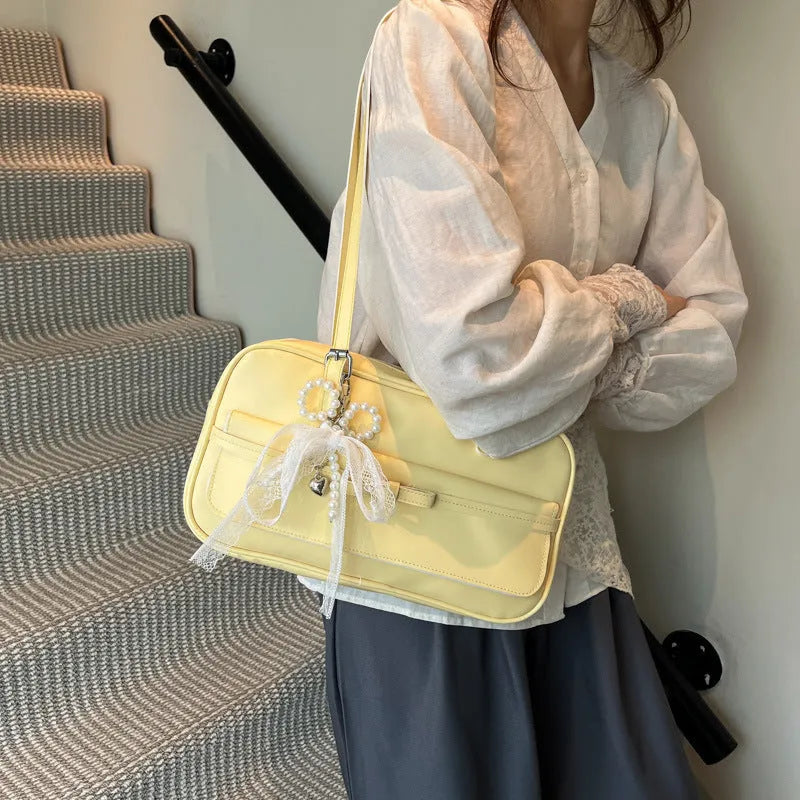 Women's PU leather single shoulder bag in horizontal square shape with flap closure and double straps