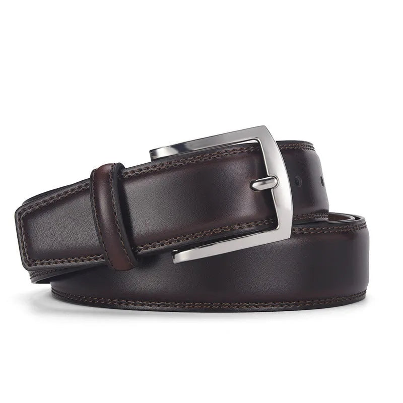 Men's black leather belt with a silver alloy pin buckle laid flat, showing its length and width.