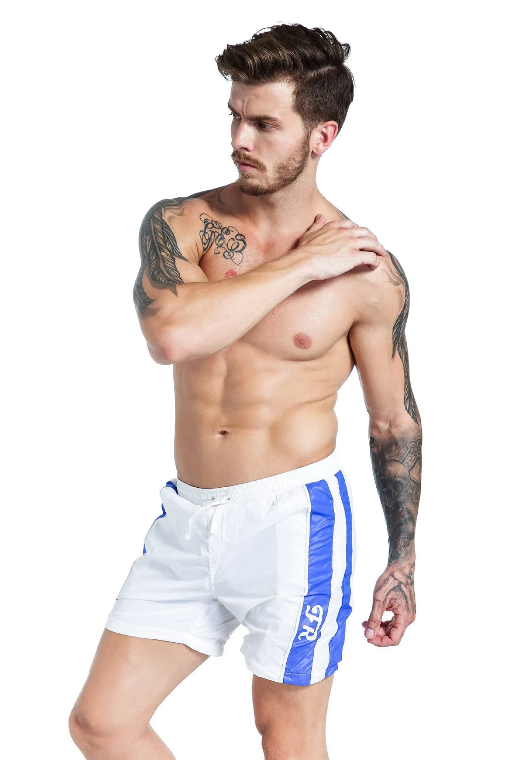 Men's blue sports shorts with lace-up front and slim fit, shown on a model.