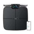 Black eight-electrode intelligent body fat weighing scale on a flat surface.