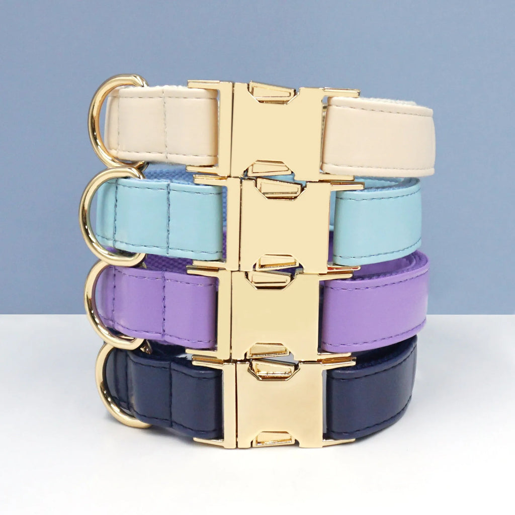 Solid colour leather dog collar shown in a selection of hues including caramel, dark blue and rose pink.