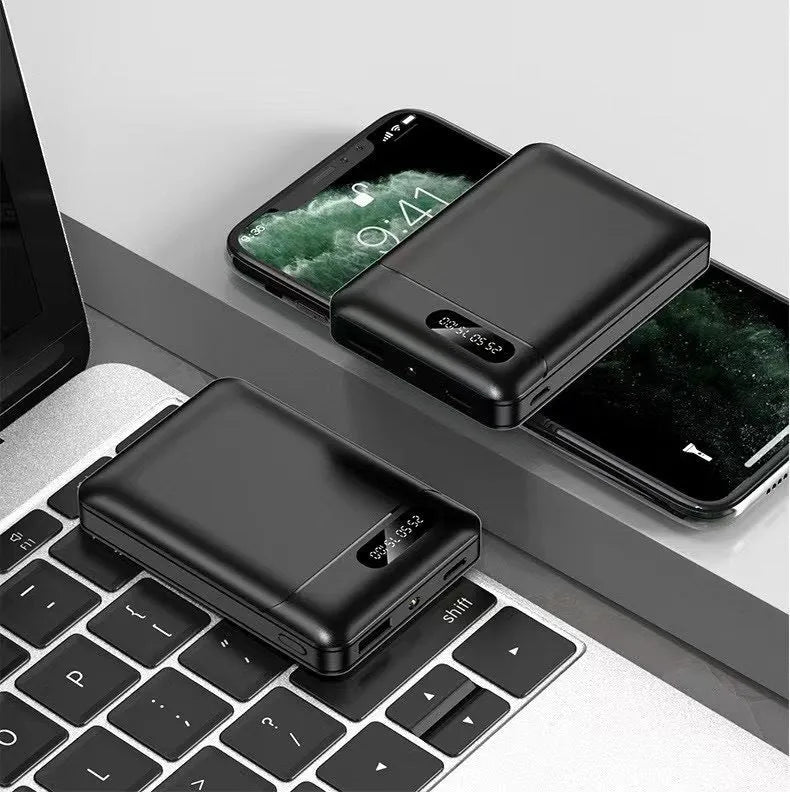 White and black portable power bank showing multiple USB ports and compact 92x63x23mm dimensions
