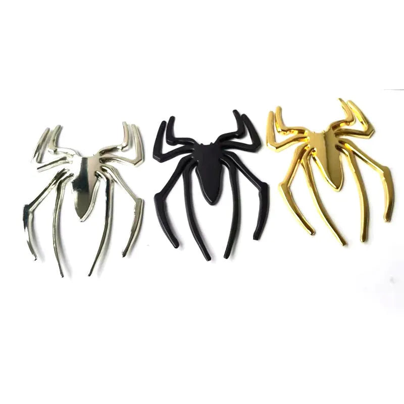 Three-dimensional metal spider bumper sticker in zinc alloy, showing gold colour option.