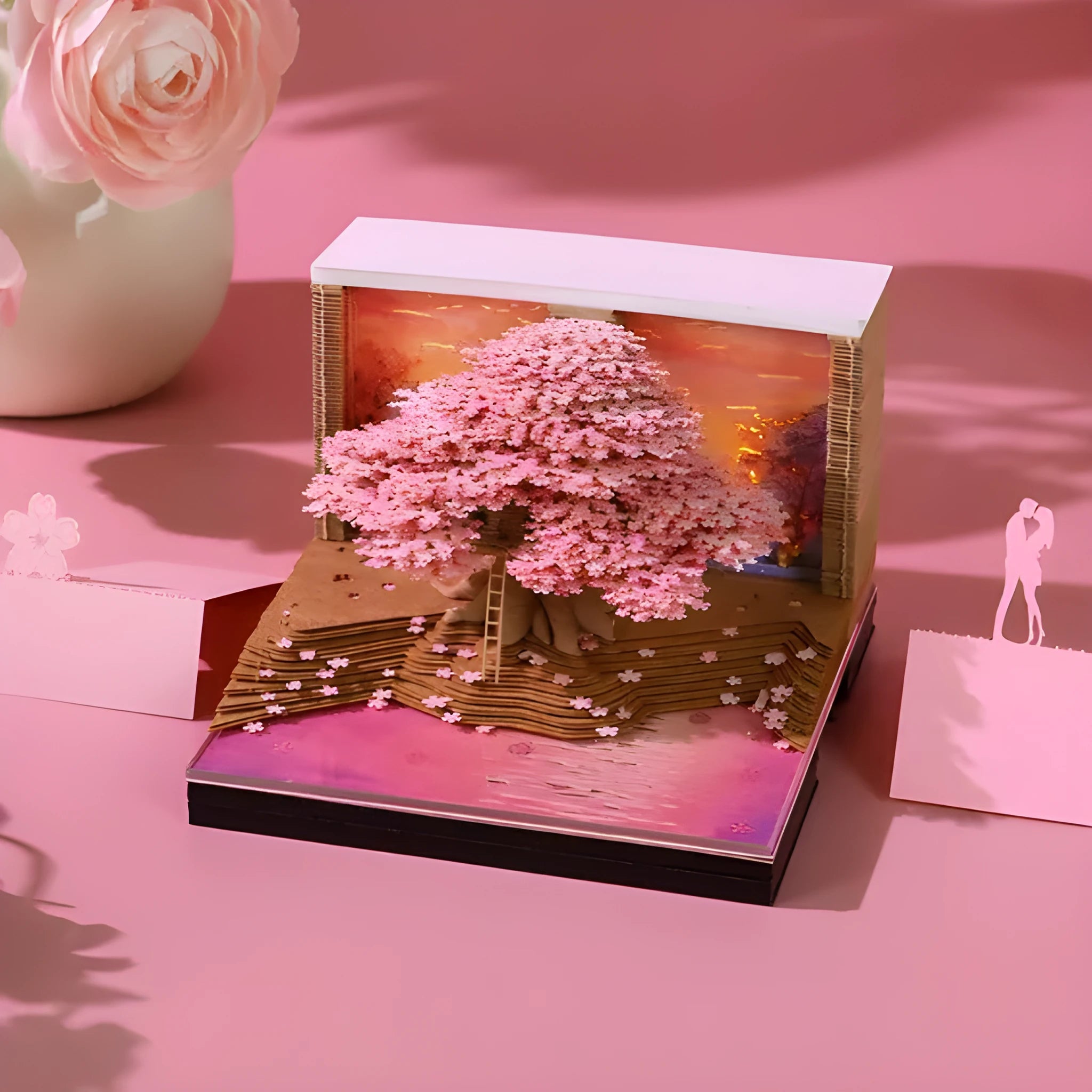 2026 desk calendar with 3D Cherry Tree paper sculpture on a desk, 8.5 x 8.5 x 6.4 cm