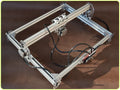 Miniature desktop laser engraving machine with 400mm by 300mm base plate for marking and lettering.