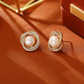 Natural pearl winding ear studs with real gold plating on copper base geometric round design
