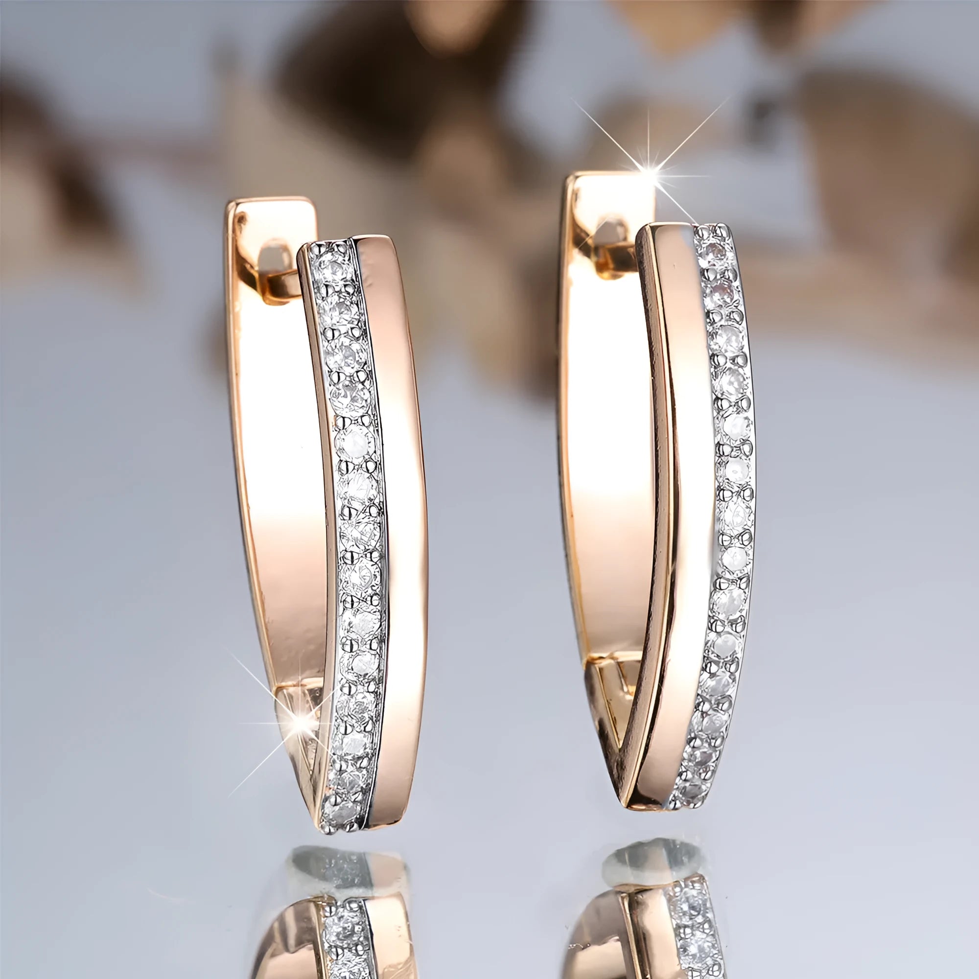Geometric V-shaped women's ear clips with champagne gold electroplated finish on copper