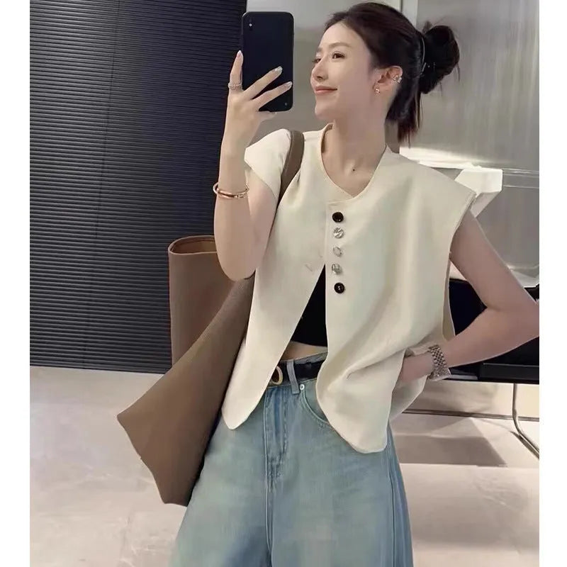 Women's milky white loose-fit polyester vest with pockets, shown with a short 40cm length.