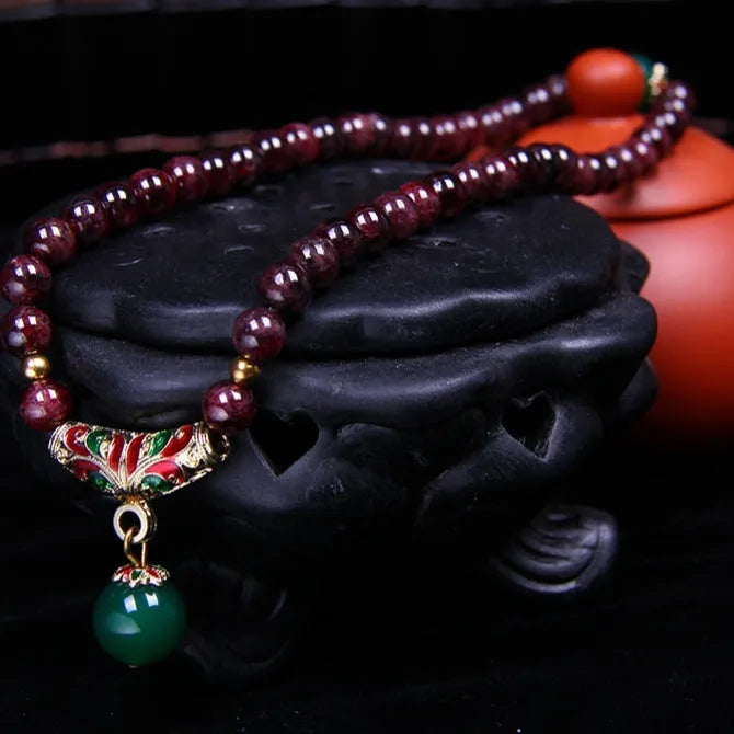 Natural garnet bracelet with 7mm beads, double ring design and Golden Toad charm jewellery