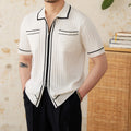 Slim black elastic lapel polo shirt with short sleeves on a hanger.