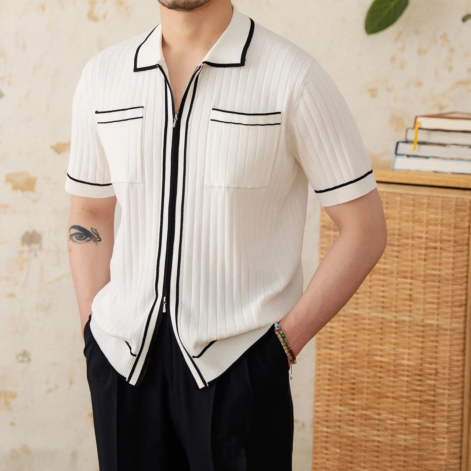 Slim black elastic lapel polo shirt with short sleeves on a hanger.
