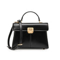 Women's black leather shoulder bag with vachette clasp showing horizontal square shape and adjustable strap