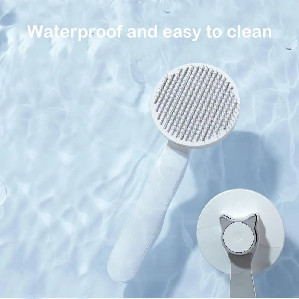 Blue self-cleaning cat brush with rubber handle and button for one-click hair removal.