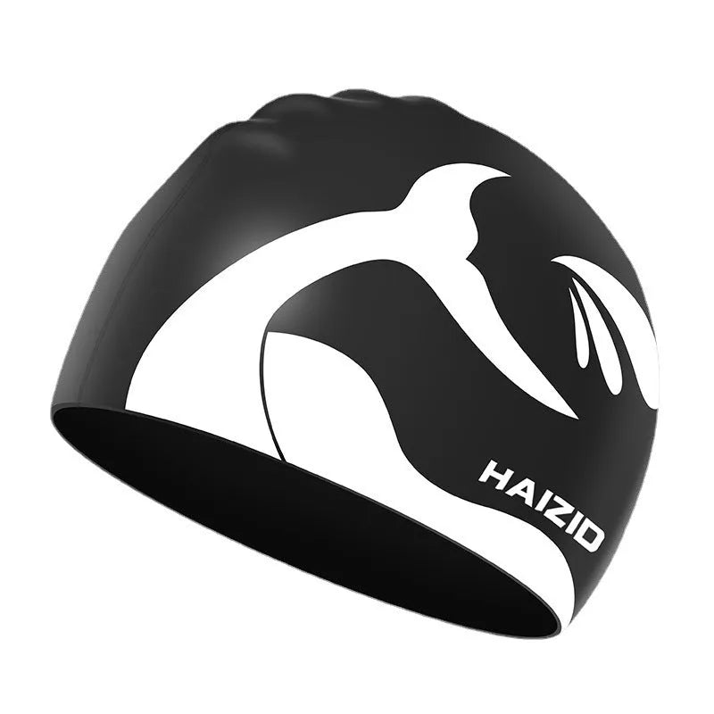 Silicone swim cap with ear protectors in whale tail design, shown in multiple colours.