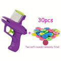 Green battery-free cat toy launcher with foam discs for interactive indoor pet play