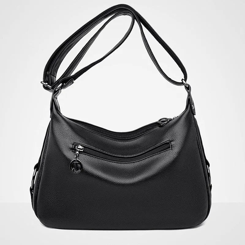 Women's blue crossbody shoulder bag with multiple interior pockets and zip closure
