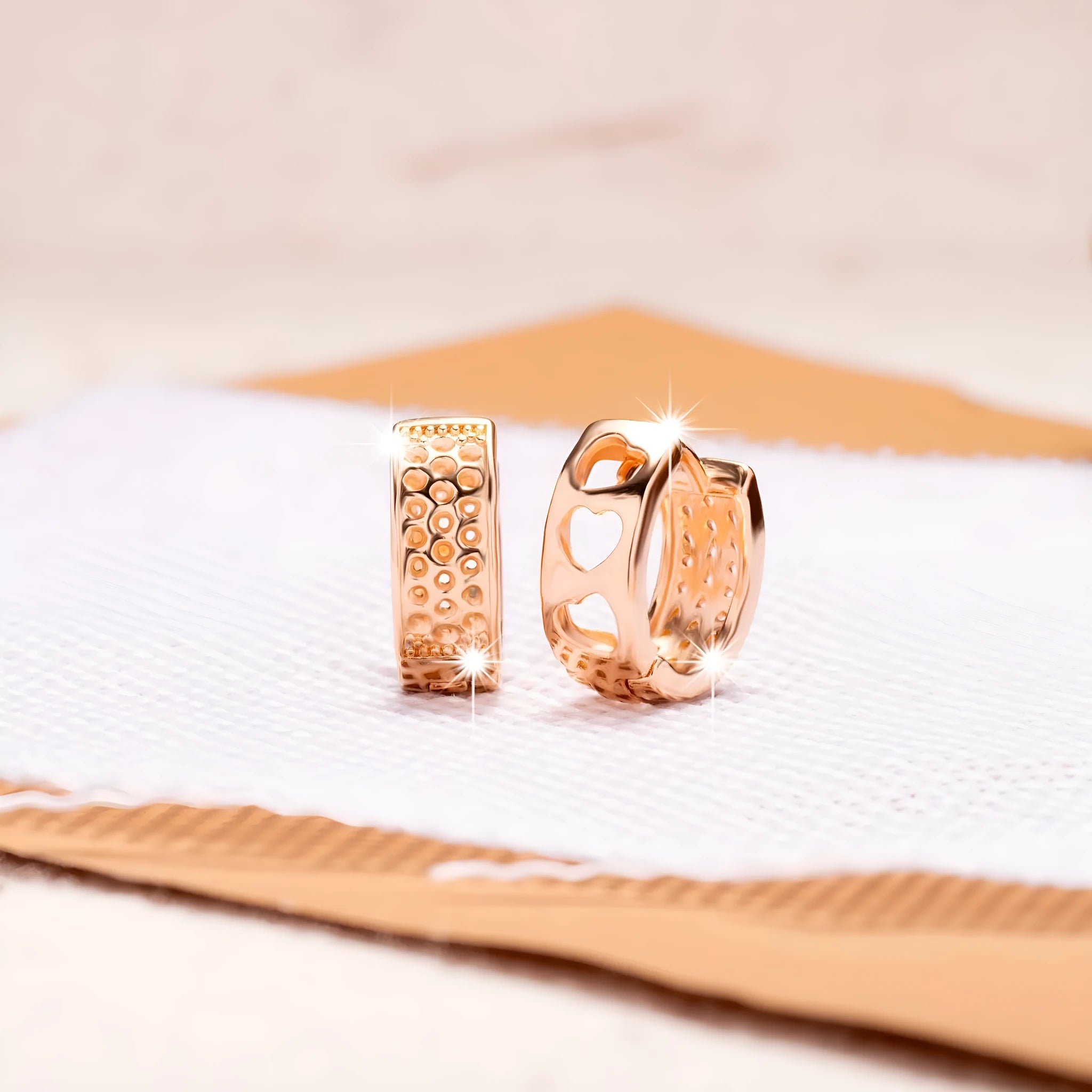Rose gold hollowed heart shaped women's earrings with electroplated finish