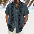 Man wearing a loose multicolour printed polyester shirt in a cardigan style.