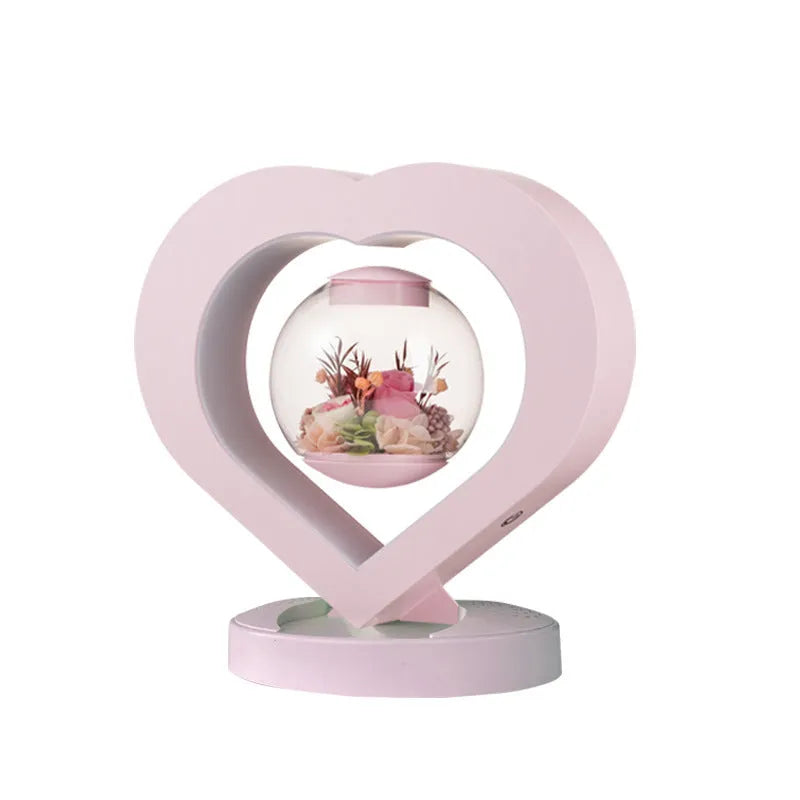 Pink preserved rose ornament with optional Bluetooth audio base and multiple plug options