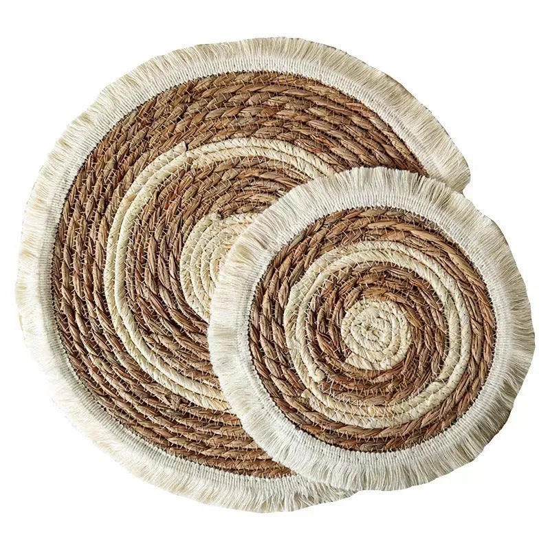 Round Japanese placemat made from natural papyrus with decorative tassels in modern simple style