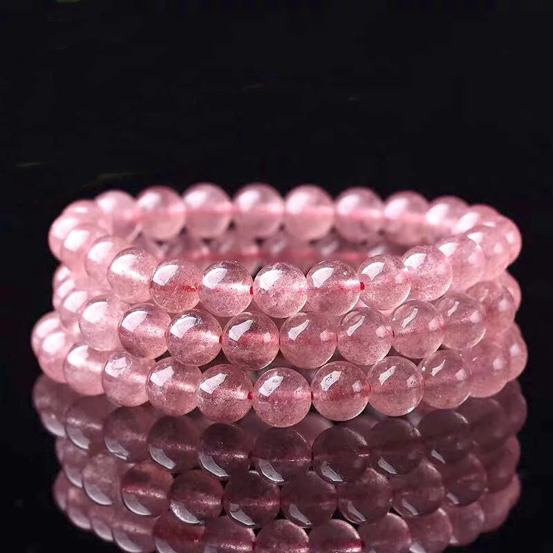 Women's strawberry quartz crystal bracelet with polished beads in three sizes