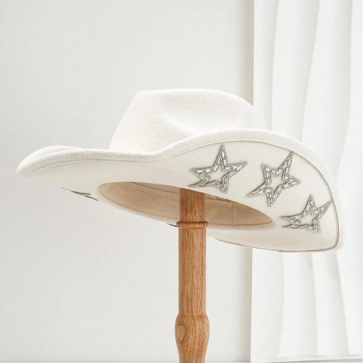 Beige polyester western-style top hat with a conical crown and a woven hexagonal star pattern.