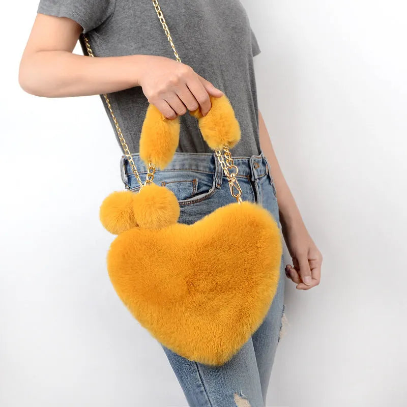 Love Bags soft plush heart-shaped handbag with zipper closure and removable handle in solid colour
