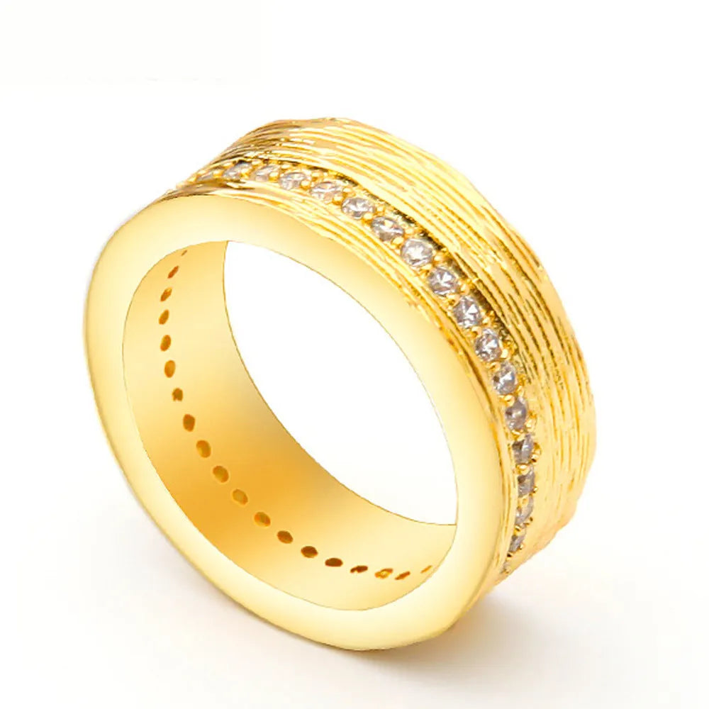 Gold geometric zircon ring on finger showing angular design and electroplated finish