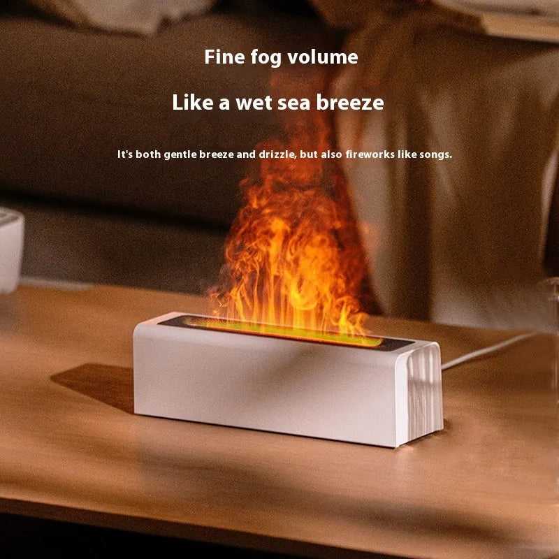 Square black USB aroma diffuser with colourful simulated flame light on a wooden table.