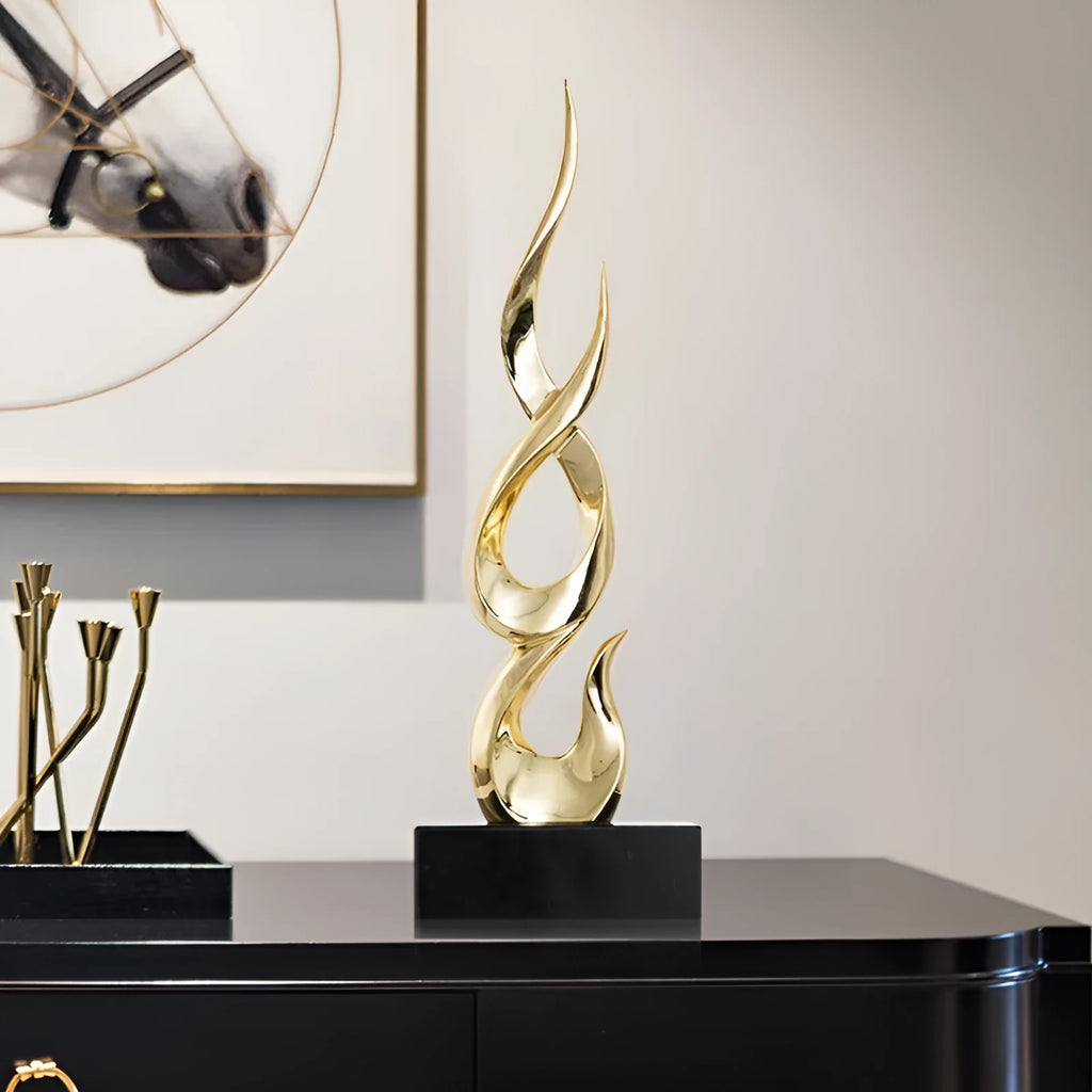 Resin decorative ornament in gold colour with modern minimalist design for festival decoration