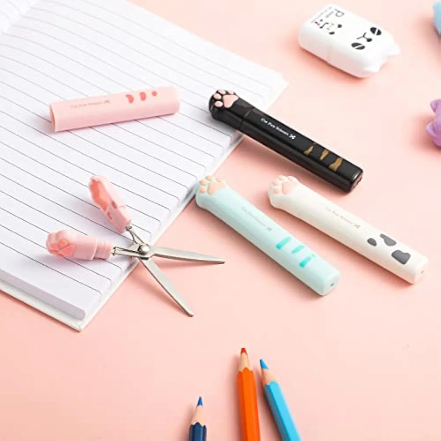 Cat paw mini folding scissors in pink, white, black, and blue colours showing closed and open positions