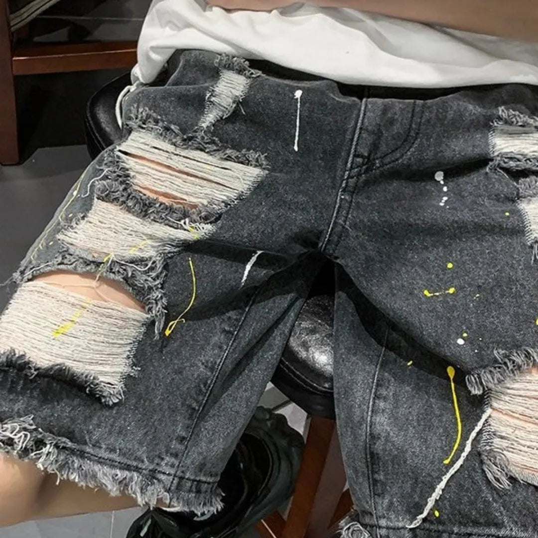 Men's water washed hole denim shorts in loose street style cut, available in black or light blue colours