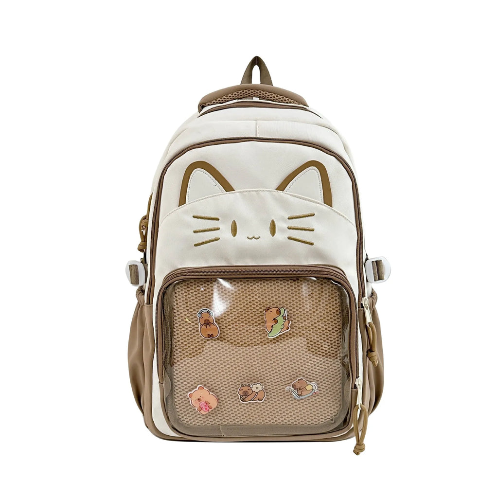 Cartoon style large capacity nylon backpack in pink with badge pendant, showing curved shoulder straps