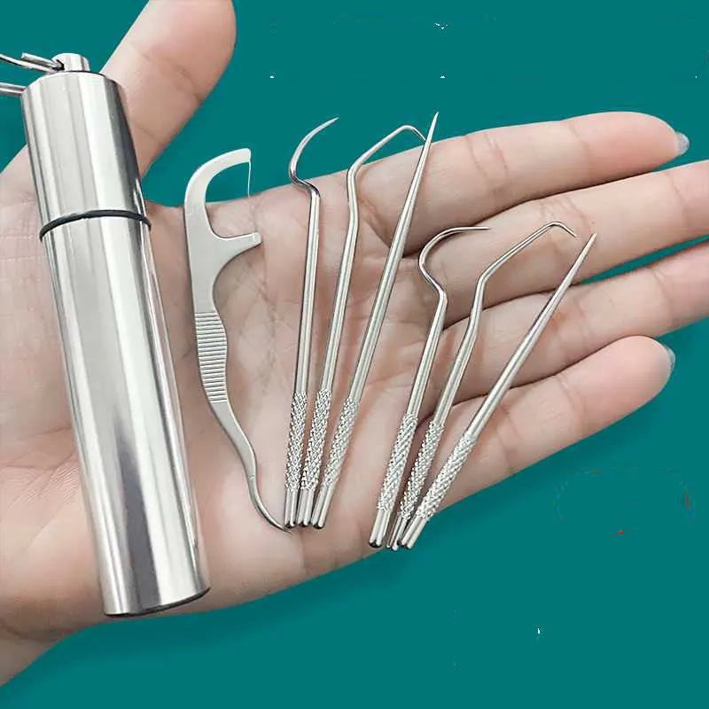 7-piece 304 stainless steel toothpick set with dental floss in a white portable cylinder