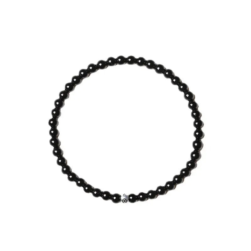 Geometric agate bracelet with black, blue, and obsidian 4mm beads and electroplated finish