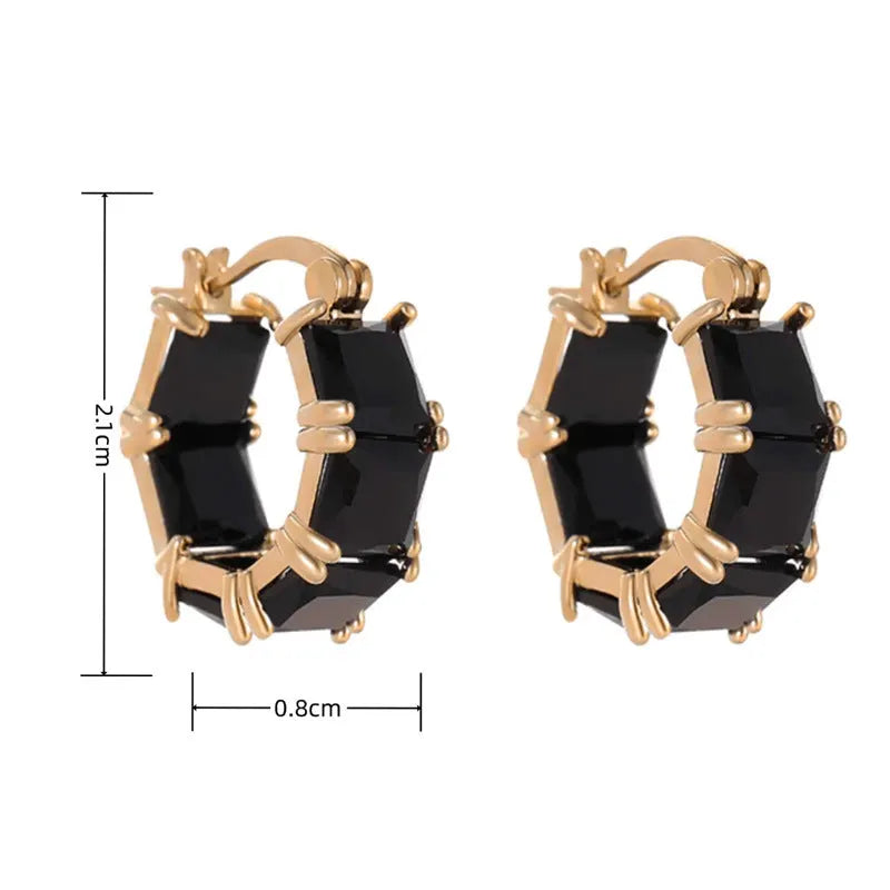 Geometric U-shaped gold tone earrings with round black zircon stone.