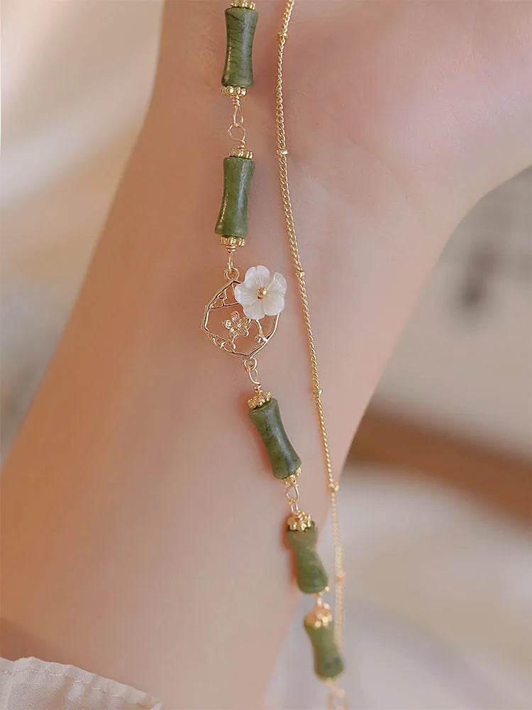 Green olivine double layer bracelet with Bells of Ireland charms and olive branch detailing for women