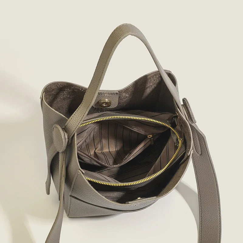 Soft PU bucket messenger bag in elephant gray with sewing line detailing and single shoulder strap