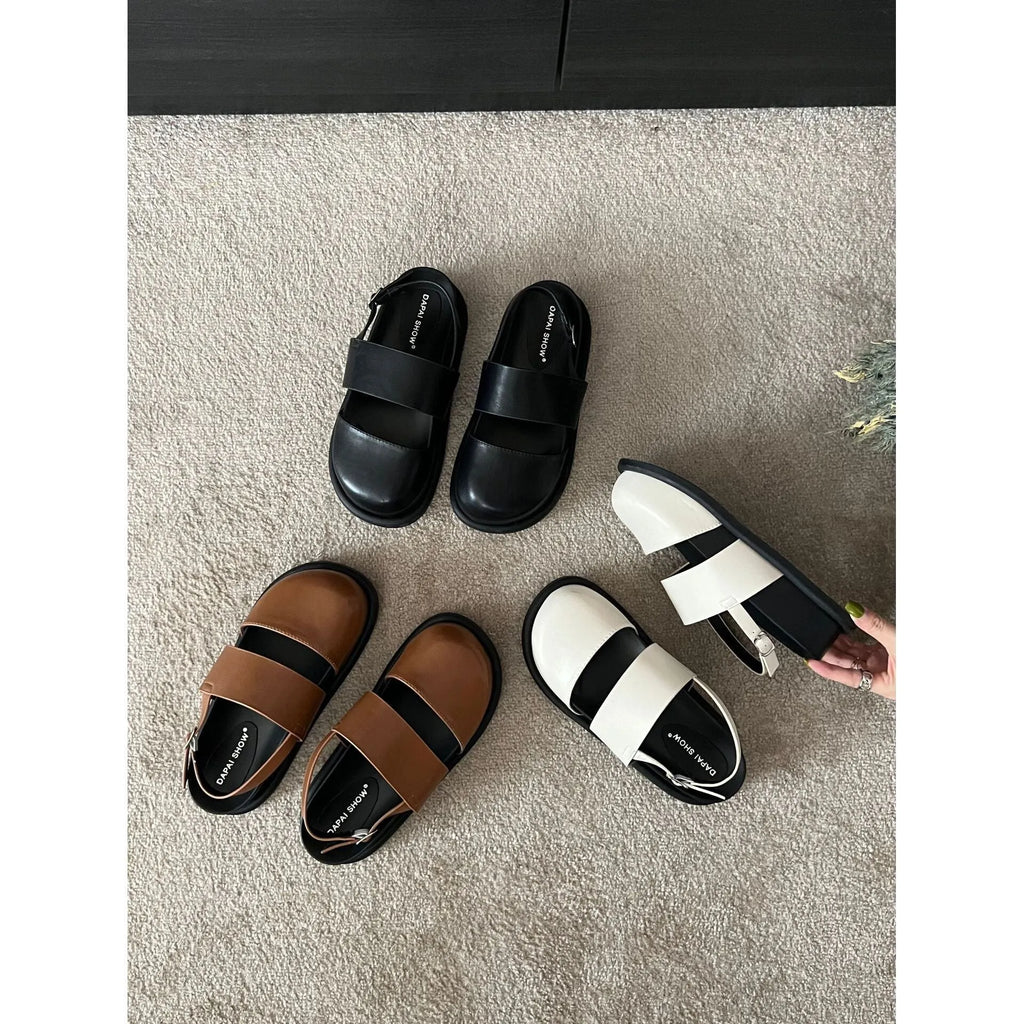 Retro raised sandals with ankle strap buckle in apricot colour showing closed toe design