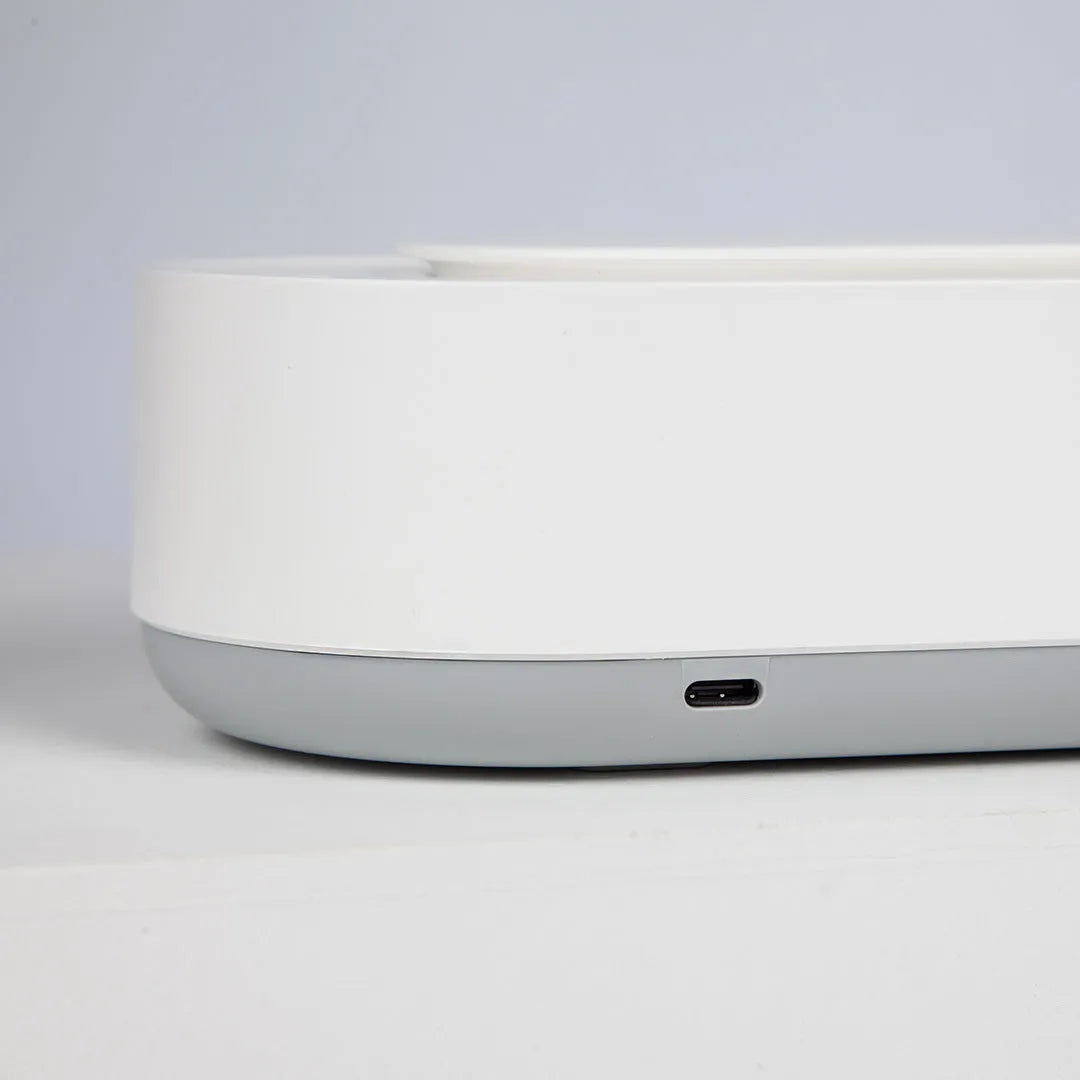 White portable ultrasonic cleaning machine with stainless steel tank and touch button.