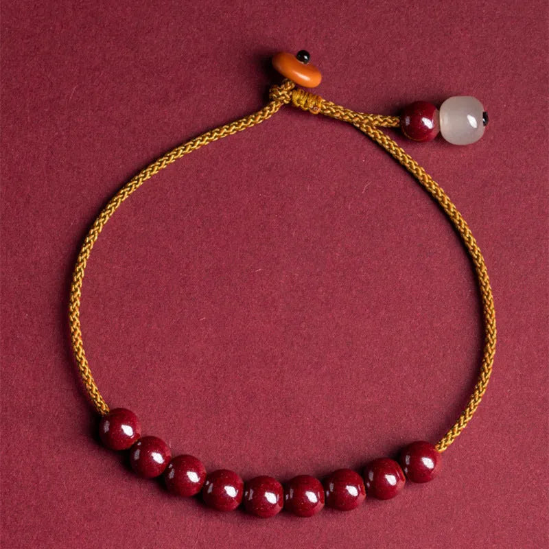 Cinnabar and Hetian jade geometric bracelet with hand-woven construction